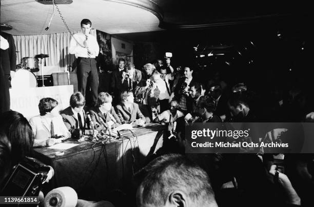 English rock group the Beatles hold a press conference at Cinnamon Cinder in Los Angeles, California, before their performance at the Hollywood Bowl,...