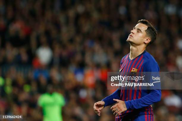 Barcelona's Brazilian midfielder Philippe Coutinho reacts to missing a goal opportunity during the Spanish League football match between FC Barcelona...