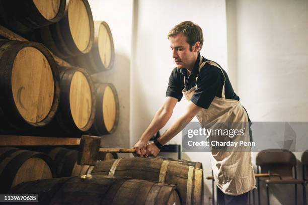 each barrel is tightly sealed - distillery stock pictures, royalty-free photos & images