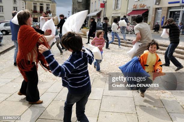 Pillow Fight in Pouzauges, Vendee, France On March 28, 2009-Pillow fight in Pouzauges in the western of France. Dozens of people gathered for the...