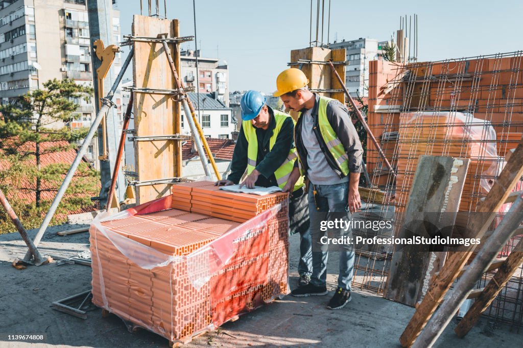 Construction Worker Introduction Experienced Construction Worker Is Explaining Building Project To His ...