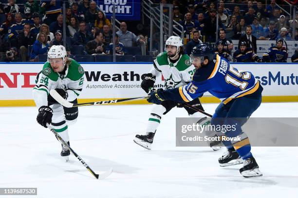 Robby Fabbri of the St. Louis Blues takes a shot as Roope Hintz of the Dallas Stars defends in Game Two of the Western Conference Second Round during...