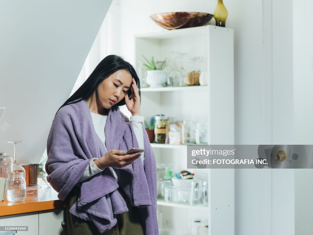 Young Asian woman sick at home
