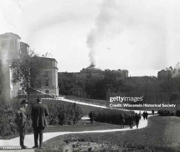 View from distance of Bascom Hall dome burning on the University of Wisconsin-Madison campus, Madison, Wisconsin, October 10, 1916. Smoke is...