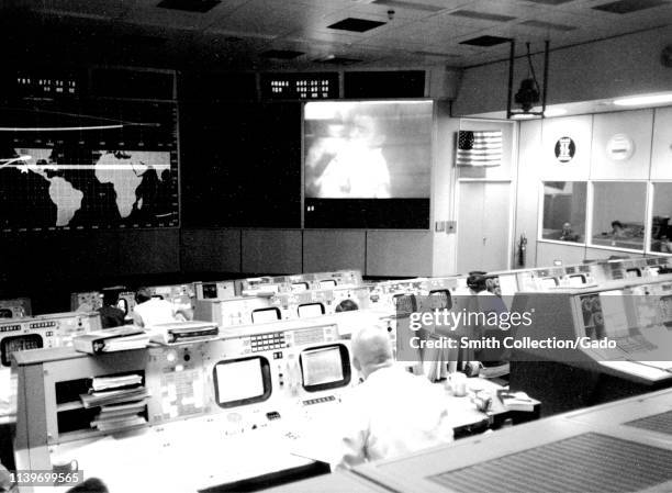 Photograph of the Apollo 13 Mission Operations Control Room in the Mission Control Center at the Manned Spacecraft Center, Huston, Texas, Eugene F....