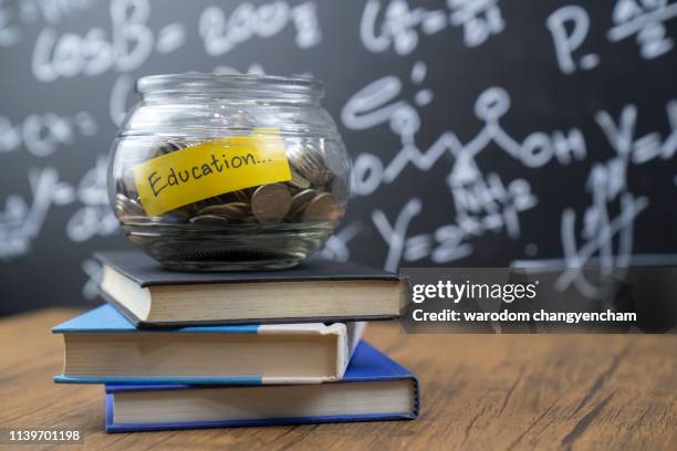 glass jar saving money scholarship for education in future on wood table,vintage. - image - scholarship award stock pictures, royalty-free photos & images