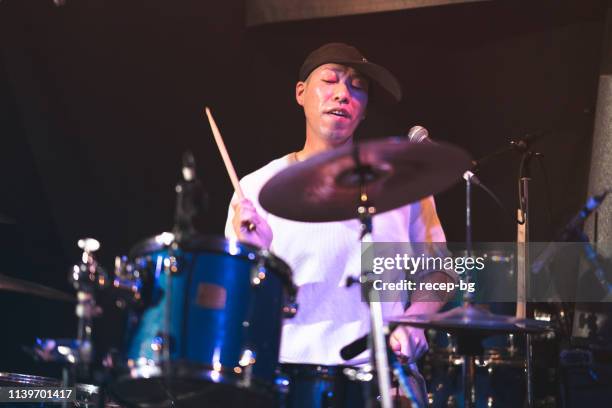 japanese drummer performing on stage - asian musician stock pictures, royalty-free photos & images