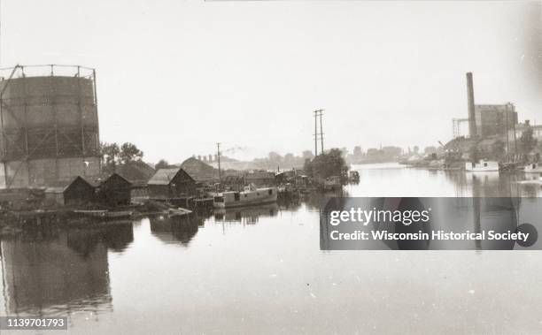 View of the Fox and East River confluence, Green Bay, Wisconsin, 1920. On the right is the Northern Paper Mill and a coal yard is to the left.