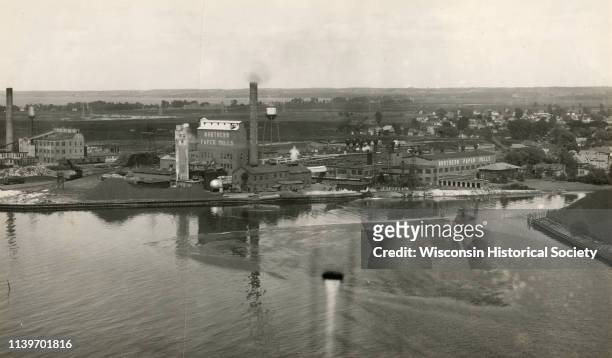 Aerial view of the conluence of the Fox River and the East River, Green Bay, Wisconsin, 1920. The Northern Paper Mills are in the foreground and the...