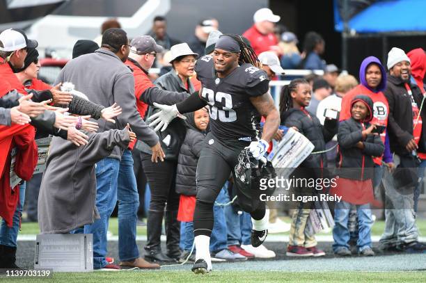Trent Richardson of the Birmingham Iron runs runs out for the tunnel before the game against the Atlanta Legends during the Alliance of American...