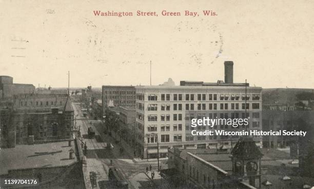 View of buildings lining Washington Street with cable cars, Green Bay, Wisconsin, 1905.