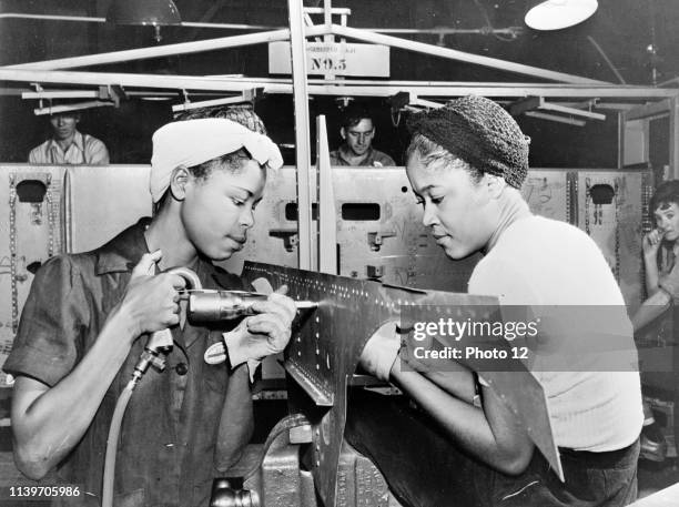 Photograph of female workers of the El Segundo Plant of the Douglas Aircraft Company. Dated 1940.