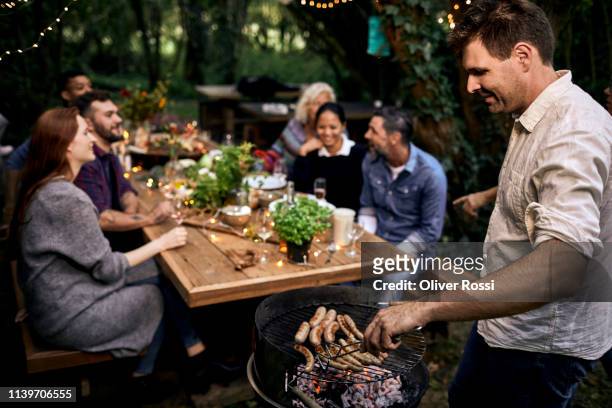 barbecue garden party - barbecue social gathering stock pictures, royalty-free photos & images