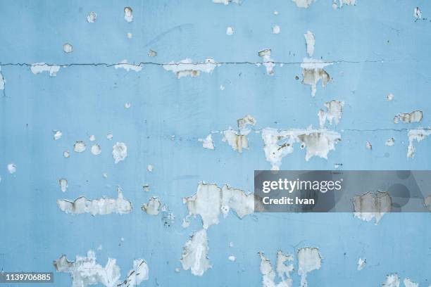 full frame of texture, paint peeling weathered blue wall - old wall foto e immagini stock