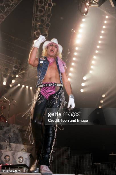 American musician and lead vocalist of the heavy metal band Mötley Crüe, Vince Neil performs onstage at the Joe Louis Arena during the Theater of...