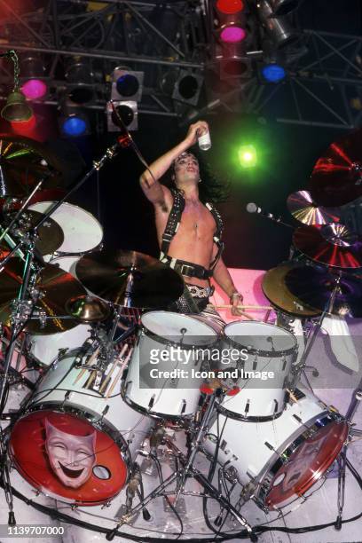 American drummer and co-founder of the heavy metal band Mötley Crüe, Tommy Lee performs onstage at the Joe Louis Arena during the Theater of Pain...