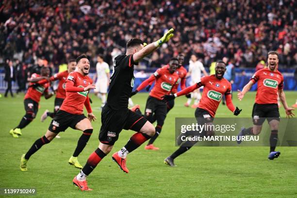 Rennes' Czech goalkeeper Tomas Koubek celebrates after Paris Saint-Germain's French midfielder Christopher Nkunku failed to score during the penalty...