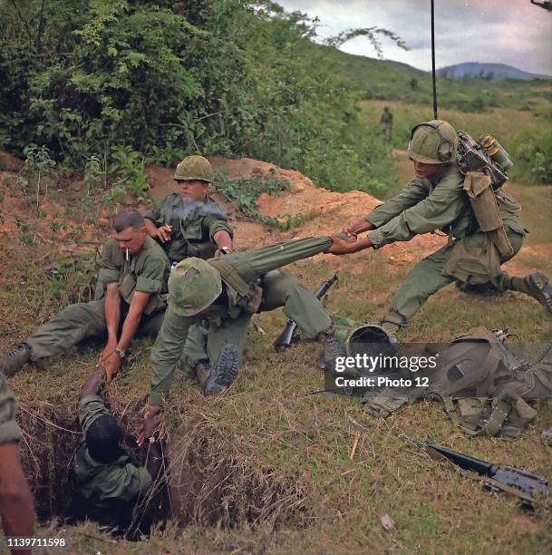 Vietnam War 1968. American soldiers uncover a Vietcong tunnel.