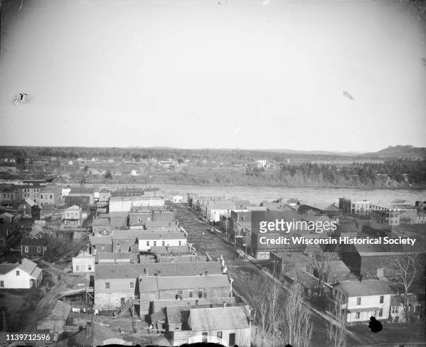 Elevated view of the river and town, Black River Falls, Wisconsin, 1885. Probably prior to 1885 because the Van Schaick building/photograph gallery...