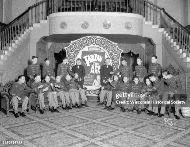 Orpheum and Capitol ushers relaxing at the Orpheum Theatre, 216 State Street, where 'Tarzan the Ape Man' is showing, at a kickoff for the Milk Bottle...