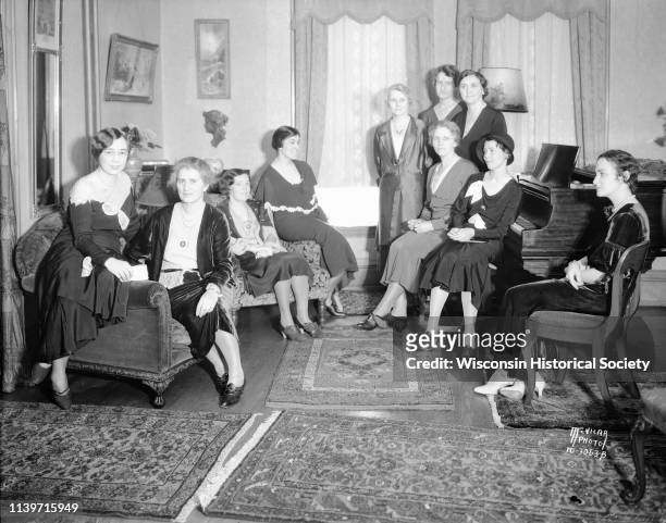 Women posing at Mrs Emma Ogg's tea party, a benefit for the scholarship fund of the University League, 1715 Kendall Avenue, Madison, Wisconsin,...