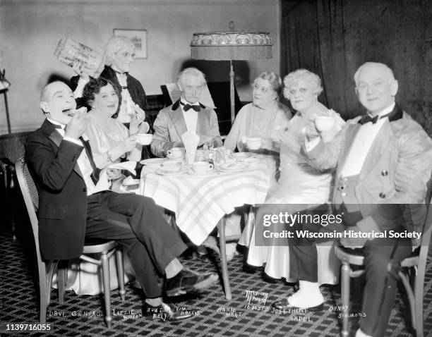 Aunt Mary putting on a 'Corn-top Bread' lunch in the Orpheum Theatre NUA room, Madison, Wisconsin, November 22, 1931. Seated left to right: Dave...