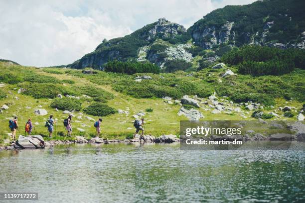 friends hiking at rila mountains - nordic walking group stock pictures, royalty-free photos & images