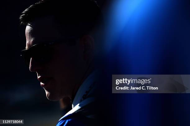 Alex Bowman, driver of the Nationwide Chevrolet, looks on during qualifying for the Monster Energy NASCAR Cup Series GEICO 500 at Talladega...