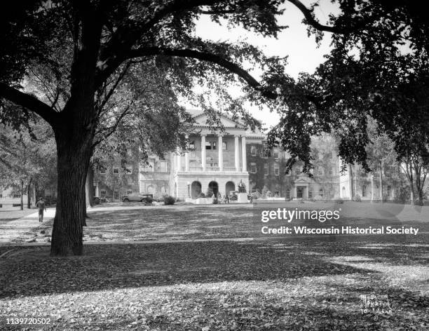 View across lawn towards Bascom Hall , with a statue of Abraham Lincoln in front at the top of Bascom Hill on the University of Wisconsin-Madison...