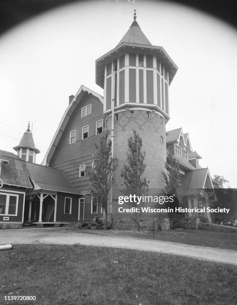 View of the University of Wisconsin-Madison dairy barn and silo, with Holstein Safety silage cutter, Madison, Wisconsin, October 12, 1926.