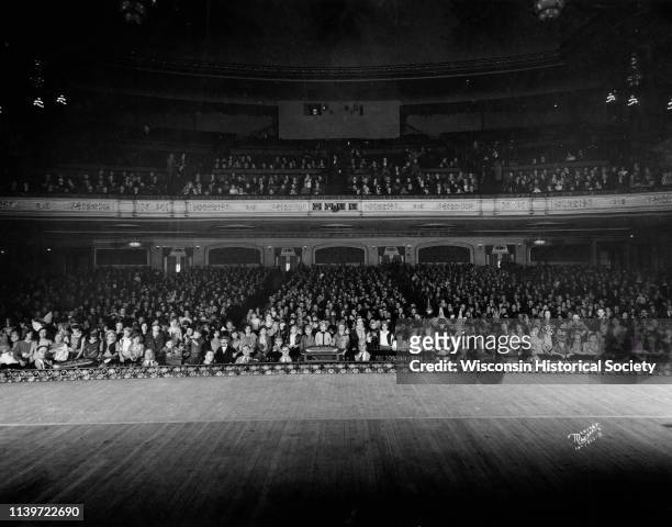 View from the stage of a full audience of costumed Halloween party-goers in the auditorium at the Orpheum Theatre, 216 State Street, Madison,...