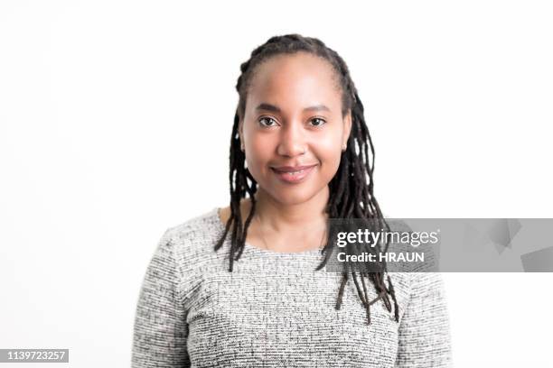 african american woman smiling on white background - locs hairstyle stock pictures, royalty-free photos & images