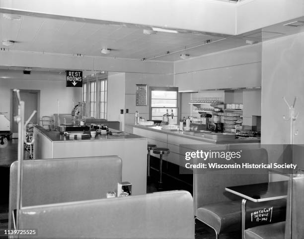 Interior of Roadside Milk Bar with soda fountain, service island, and booths, Shorewood Hills, Wisconsin, September 11, 1945. The business was...