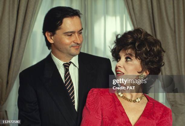 Italian Actress Gina Lollobrigida In France In February, 1994- Italian actress Gina Lollobrigida with her son Milko in February, 1993.