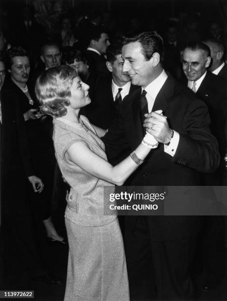 Files Pictures of Michele Morgan In France In 1956-French actress Michele Morgan with male counterpart Yves Montand during evening for 'Marguerite de...