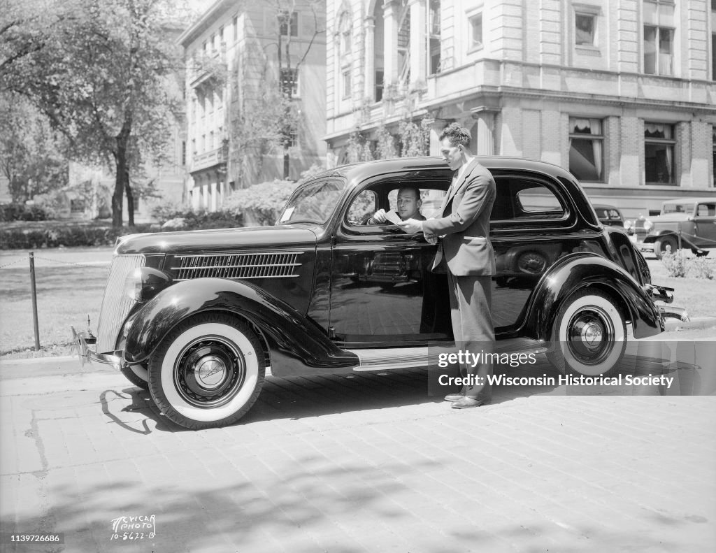 Salesman & New Ford Car