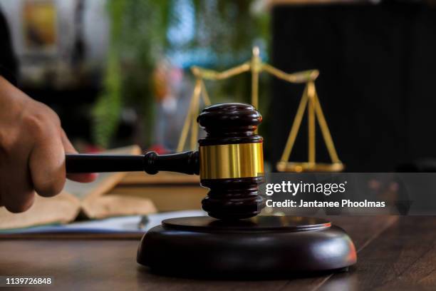 law and justice concept. judge's gavel, scales, hourglass, books. - gavel judge foto e immagini stock