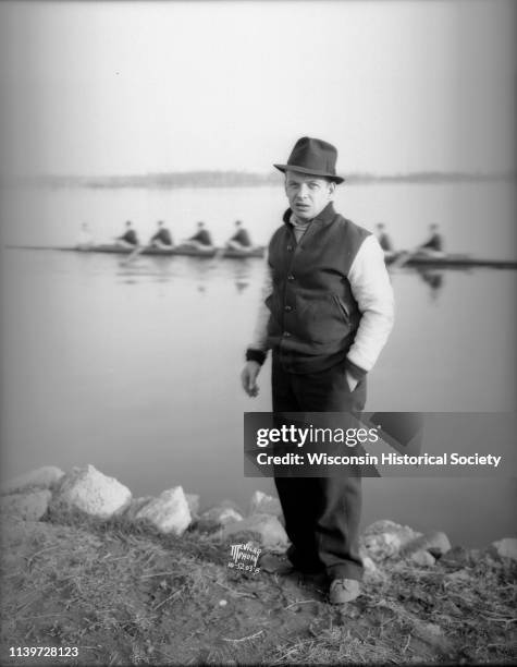 Portrait of Ralph Hunn, coach of the University of Wisconsin-Madison crew standing on the shoreline of Lake Wingra, Madison, Wisconsin, April 18,...