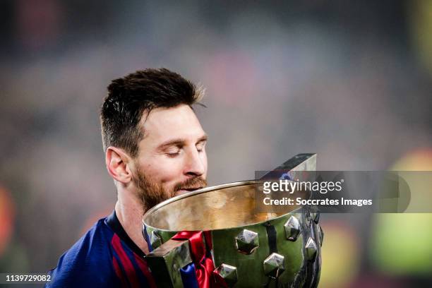 Lionel Messi of FC Barcelona, celebrate the Championship with the trophy during the Spanish Copa del Rey match between FC Barcelona v Levante at the...