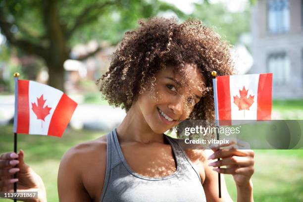 young proud canadian woman - canada day celebration stock pictures, royalty-free photos & images