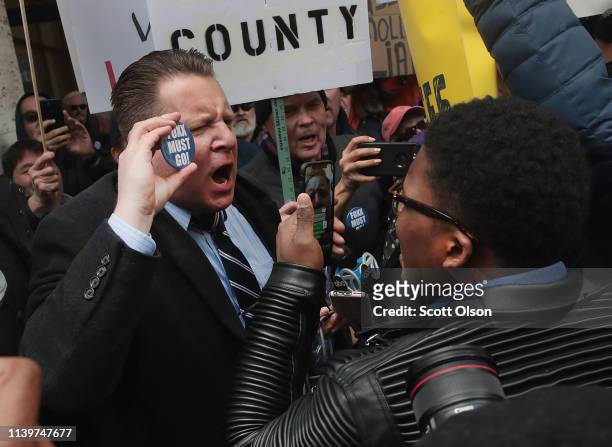Supporters of Cook County State's Attorney Kim Foxx argue with protestors during a demonstration organized by the Fraternal Order of Police to call...