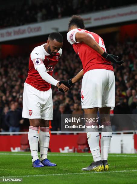 Alexandre Lacazette of Arsenal celebrates after scoring his team's second goal with Pierre-Emerick Aubameyang during the Premier League match between...