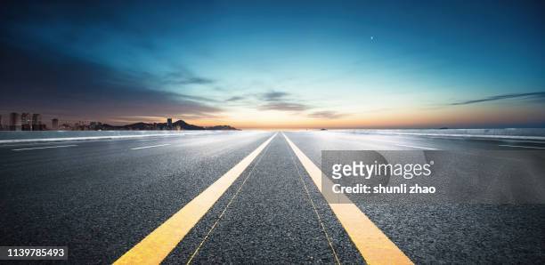 sunset boulevard - single yellow line stock pictures, royalty-free photos & images