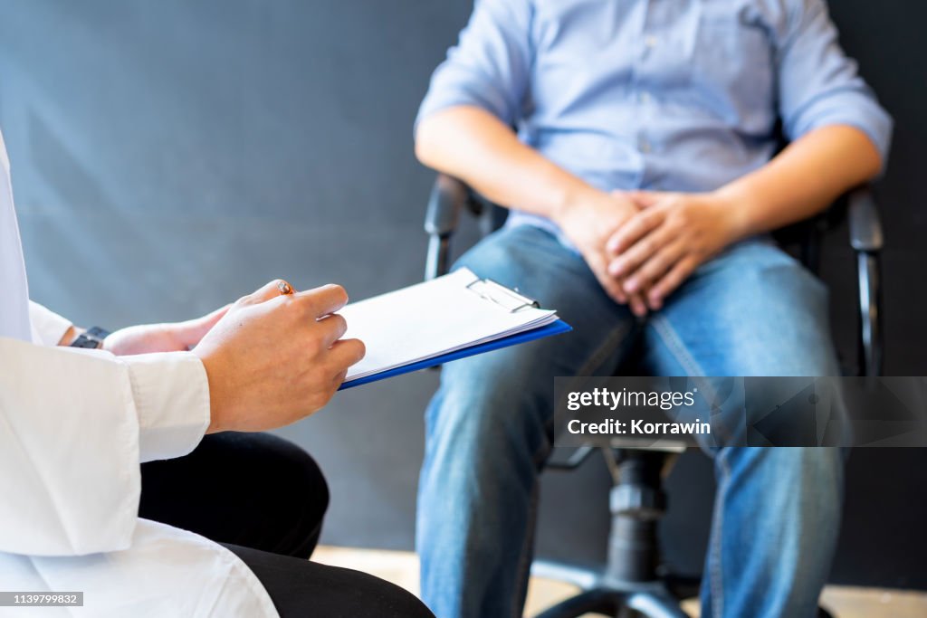 Male doctor and prostate cancer patient are discussing about prostate cancer test report. Diagnostic, prevention of men diseases, healthcare, medical service, consultation, healthy lifestyle concept.