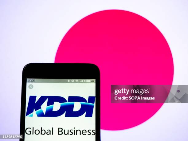 In this photo illustration a KDDI Corporation logo seen displayed on a smart phone.