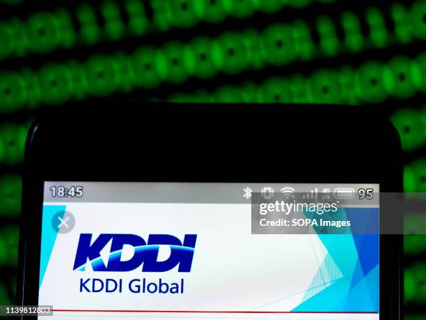 In this photo illustration a KDDI Corporation logo seen displayed on a smart phone.