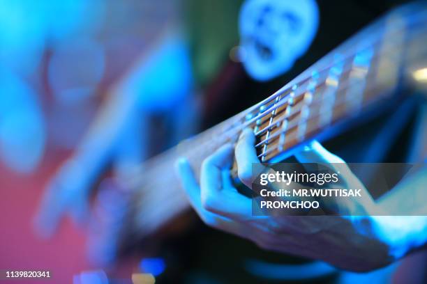 close up of man hand playing guitar. - classical guitarist stock pictures, royalty-free photos & images