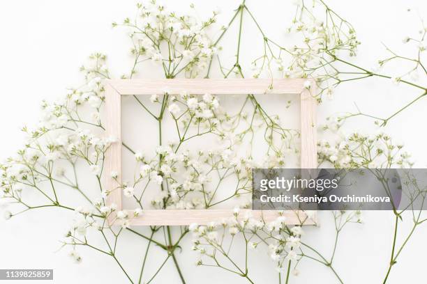 styled stock photo. feminine wedding desktop stationery mockup with blank greeting card, baby's breath gypsophila flowers, dry green eucalyptus leaves, satin ribbon and white background. empty space. - gypsophila stock pictures, royalty-free photos & images