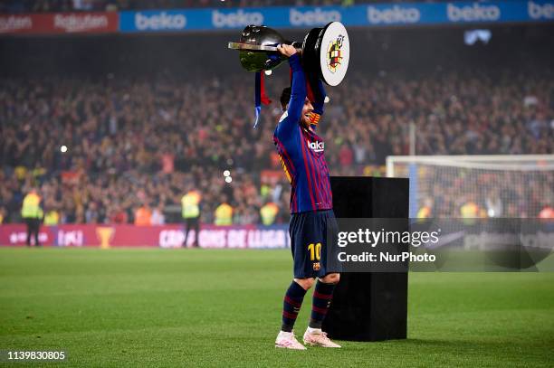 Lionel Messi of Barcelona celebrates after Barcelona won their 26th league title at the end of the Spanish League football match between Barcelona...