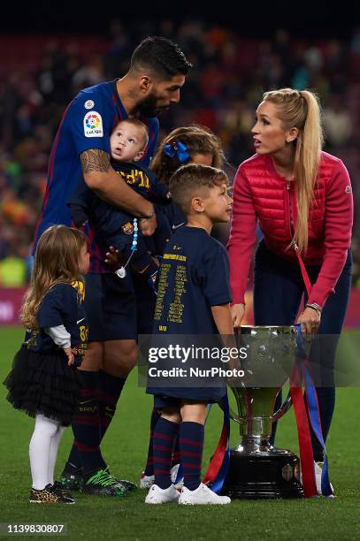 Luis Suarez and his family celebrate after Barcelona won their 26th league title at the end of the Spanish League football match between Barcelona...